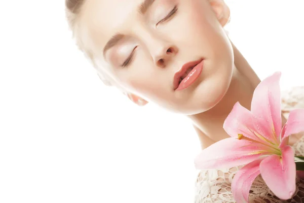 Beauty face of the young woman with pink lily — Stock Photo, Image