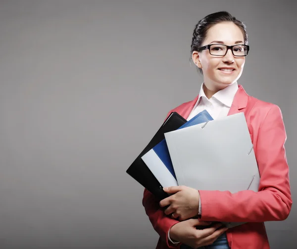 Young business woman with folders — Stock Photo, Image