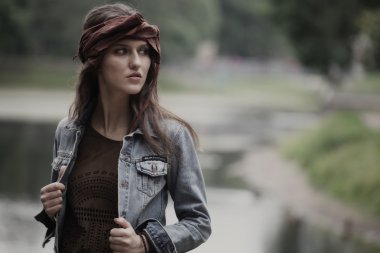 Fashion model posing in summer park