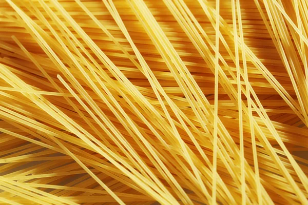 Rohe Pasta als ganzer Hintergrund — Stockfoto