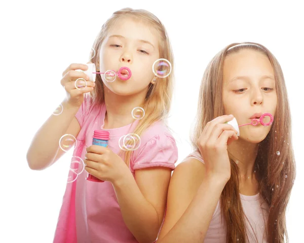 Girls with soap bubbles Stock Picture