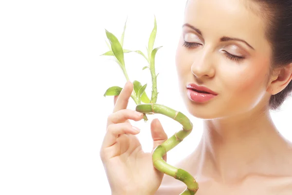 Young beautiful woman with bamboo — Stock Photo, Image