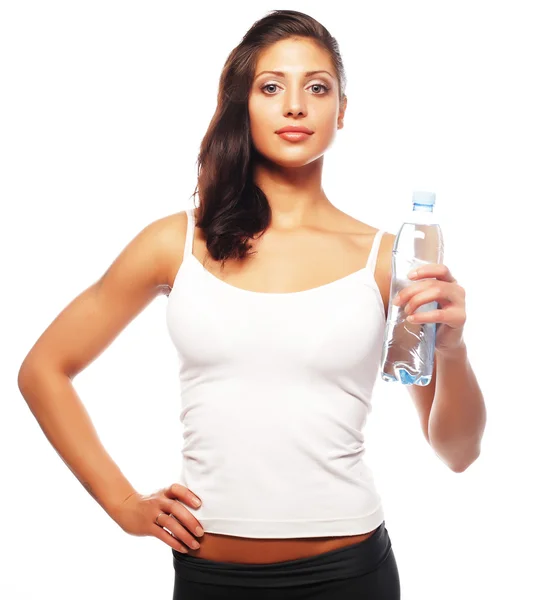 Sorrindo jovem mulher desportiva com água — Fotografia de Stock
