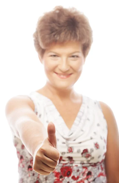 Pretty mature woman giving thumbs up — Stock Photo, Image