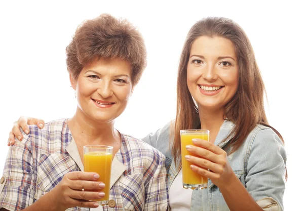 Two women with orange juice. — Stock Photo, Image