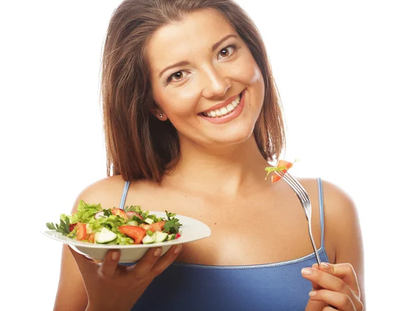 Young happy woman eating salad. — Stock Photo, Image