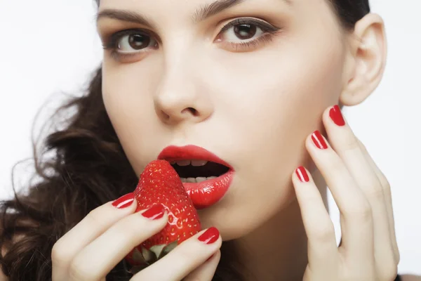 Sexy lady holding a juicy strawberry — Stock Photo, Image