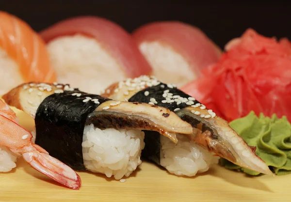 Sushi served on wooden board — Stock Photo, Image