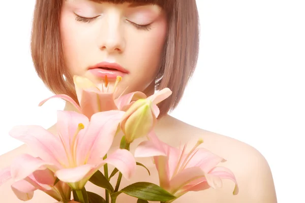 Beauty face of the young woman with pink lily — Stock Photo, Image