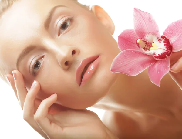 Young beautiful woman with pink flower — Stock Photo, Image