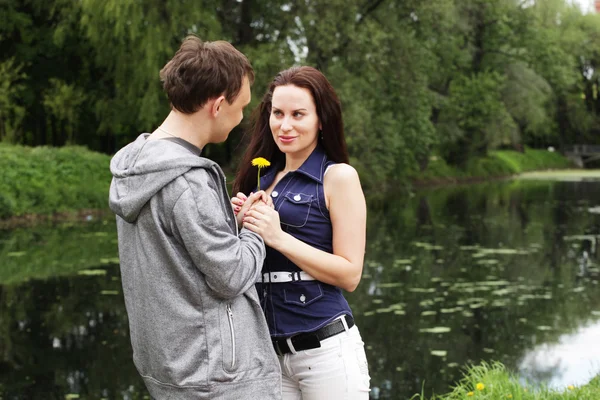 Happy young guy with girlfriend — Stock Photo, Image