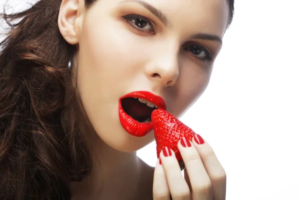 Sexy lady holding a juicy strawberry — Stock Photo, Image