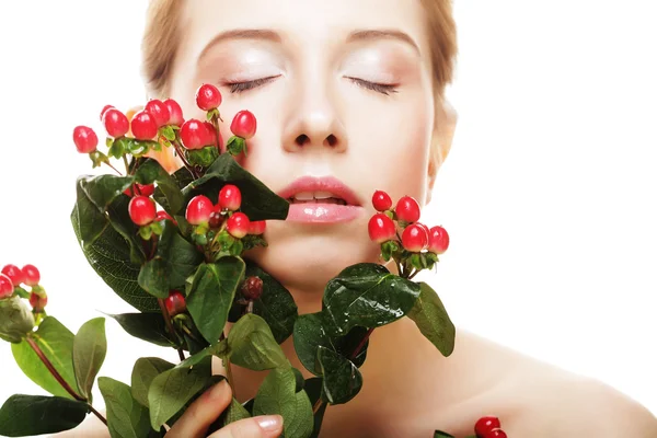 Woman holding Hypericum flowers — Stok fotoğraf