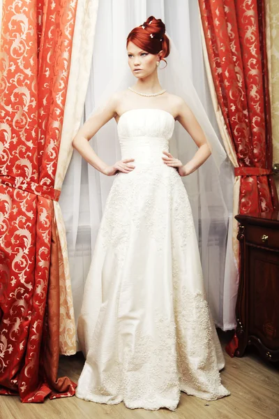 Happy bride posing in hotel room — Stock Photo, Image