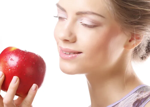 Blond kvinna med ett äpple — Stockfoto