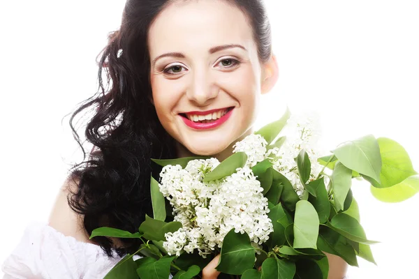 Kobieta z białymi kwiatami — Zdjęcie stockowe