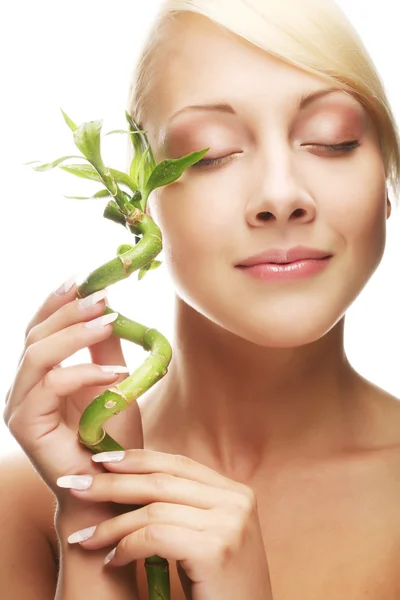 Beautiful woman with bamboo — Stock Photo, Image