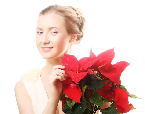 Woman with red xmas flowers — Stock Photo, Image
