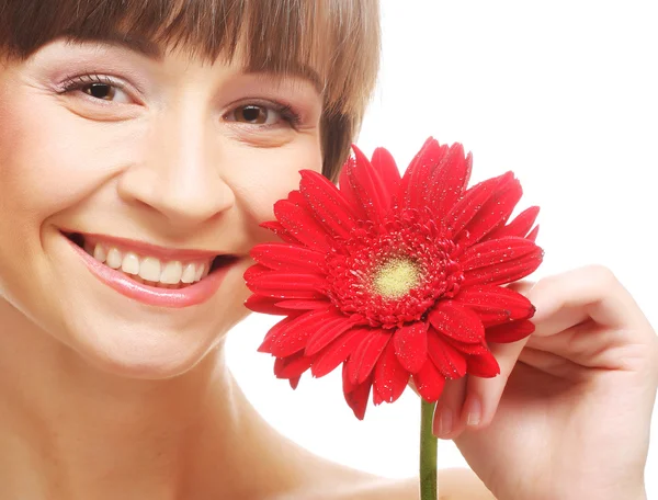 Mujer morena con un gerber rojo — Foto de Stock