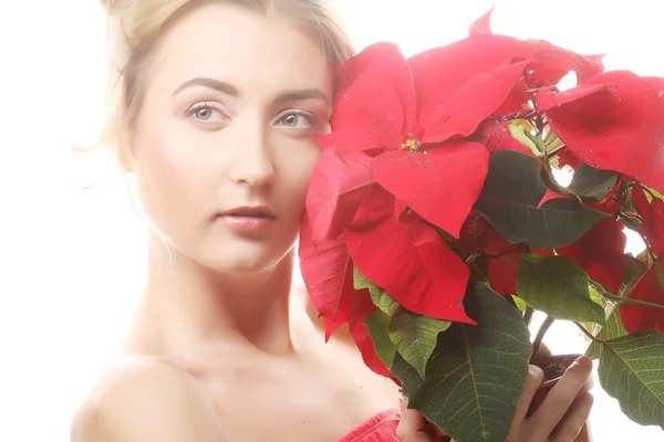 Woman with red xmas flowers — Stock Photo, Image