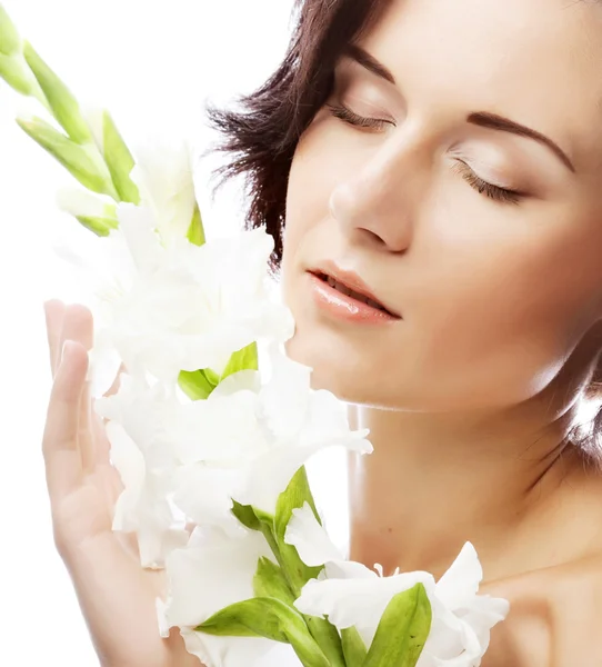 Close-up beautiful fresh face with gladiolus — Stock Photo, Image