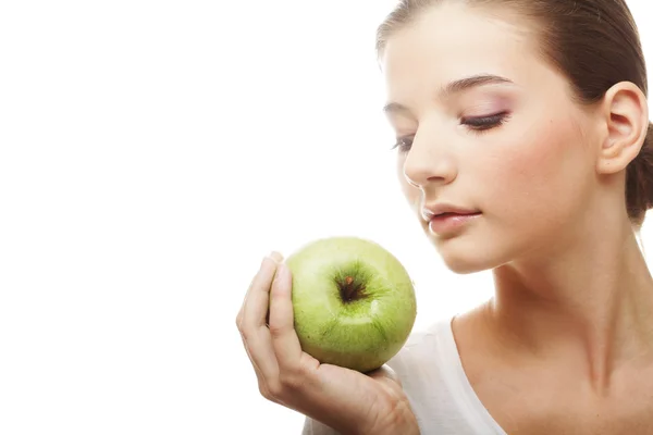 Cabeza de mujer sosteniendo manzana — Foto de Stock