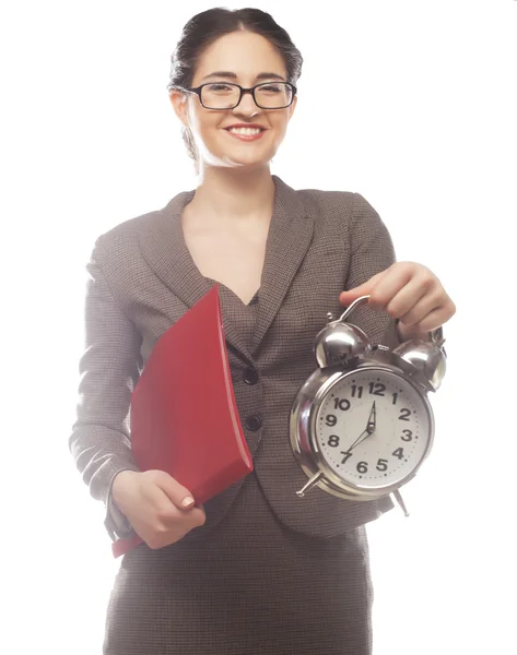 Businesswoman wearing glasses holding alarm clock — Stock Photo, Image