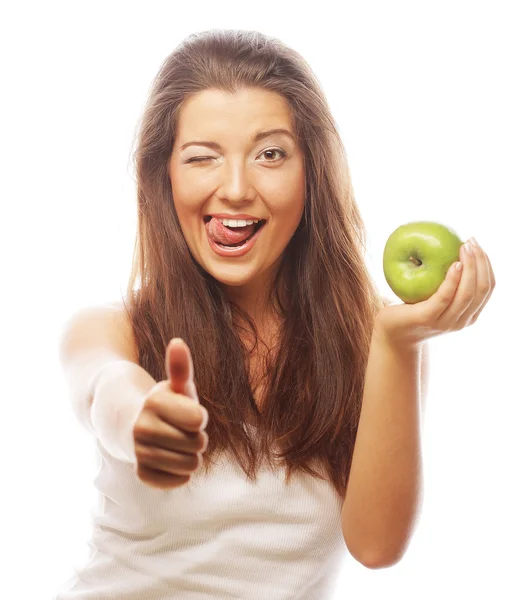 Kvinna med grönt äpple och visar tummen upp — Stockfoto