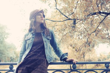 Fashion model posing in summer park