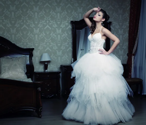 Happy bride posing in hotel room — Stock Photo, Image