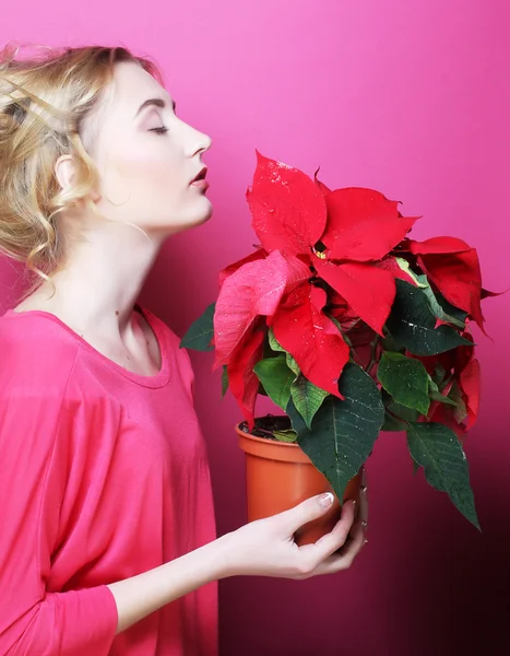 Woman with poinsettia — Stock Photo, Image