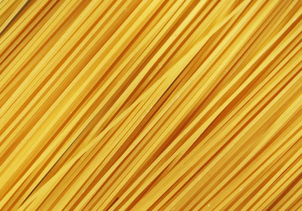 Rohe Pasta als ganzer Hintergrund — Stockfoto