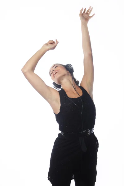 Woman dancing to music with headphones — Stock Photo, Image