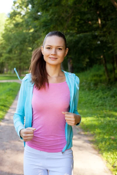 Pretty young girl runner in the forest. — Stock Photo, Image