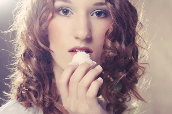 Woman eating sweet candy — Stock Photo, Image