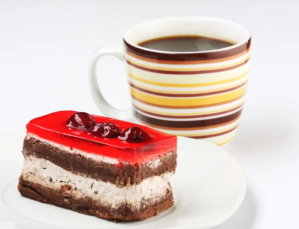 Pastel con una taza de café — Foto de Stock