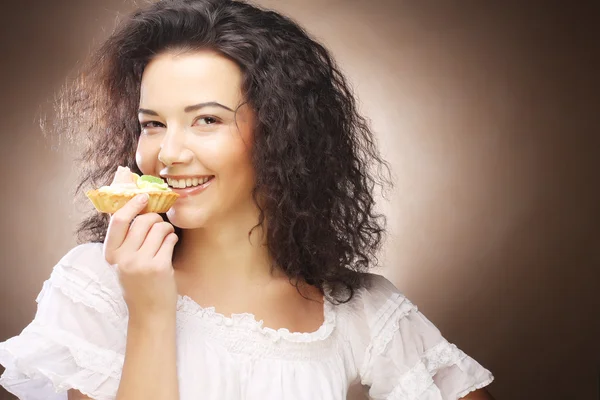 Young woman with a cake Royalty Free Stock Photos