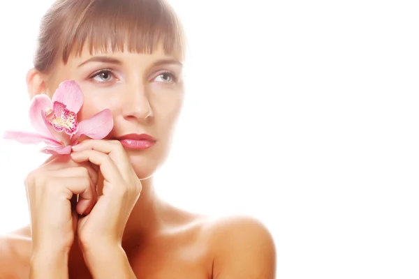 Mulher com orquídea rosa — Fotografia de Stock