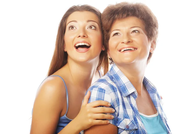 Mother and adult daughter looking up — Stock Photo, Image