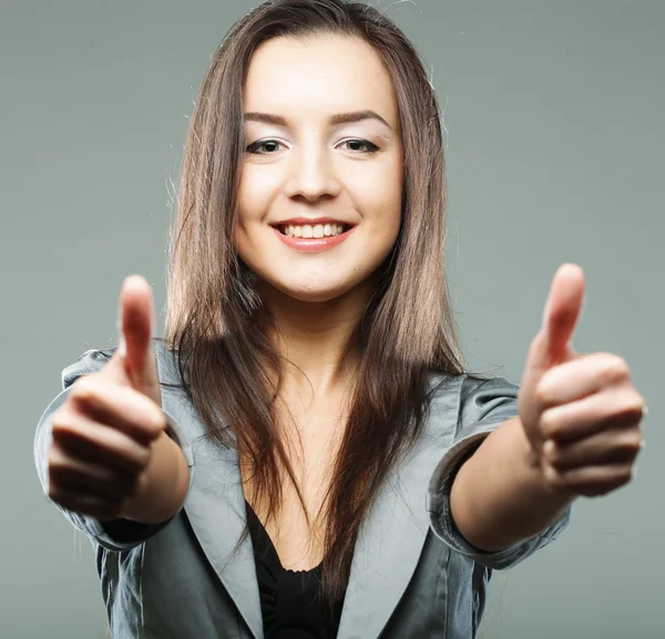 Business woman giving thumbs up — Stock Photo, Image