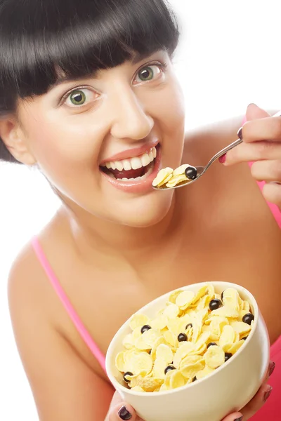 Smiling woman eating muesli — Stock Photo, Image