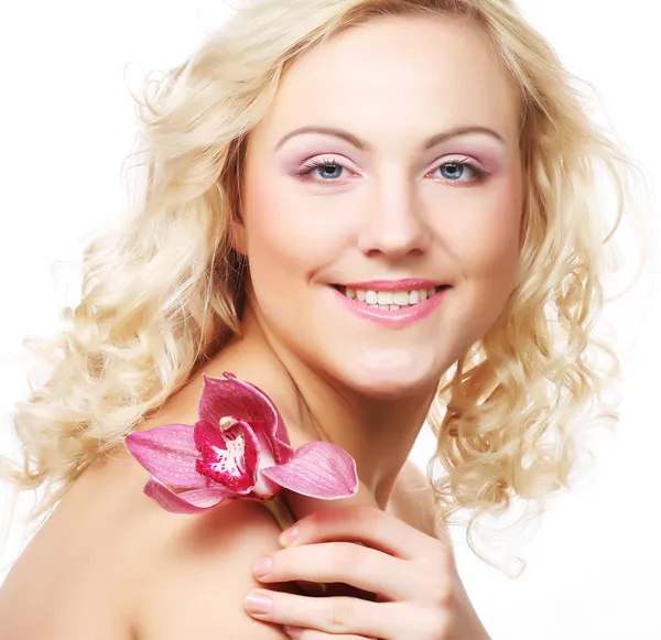 Young beautiful woman with pink flower — Stock Photo, Image