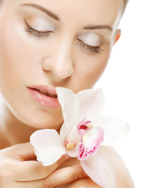 Beautiful woman with orchid flower Royalty Free Stock Images