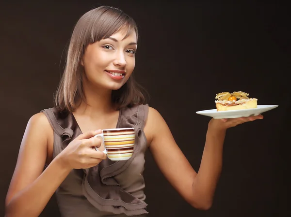 Kvinna med kaffe och dessert — Stockfoto