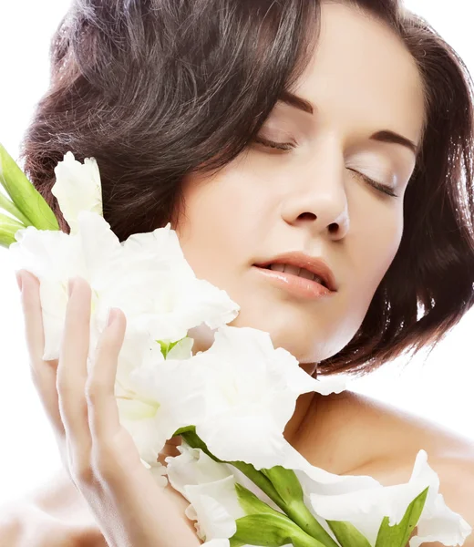 Beautiful fresh face with gladiolus flowers — Stock Photo, Image