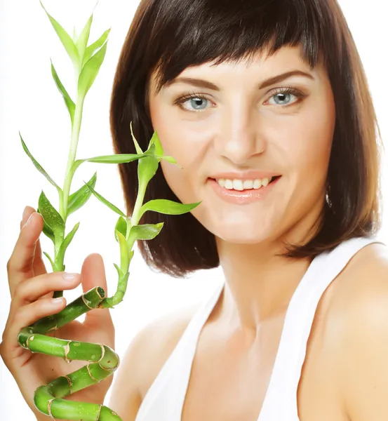 SPA. young woman with bamboo. — Stock Photo, Image