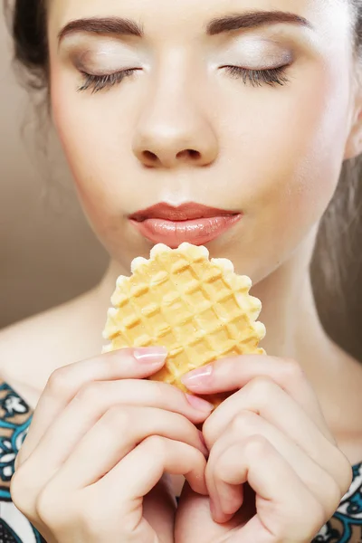 Happy lwoman with cake wafer — Stock Photo, Image