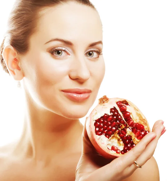 Woman showing pomegranate smiling. — Stock Photo, Image