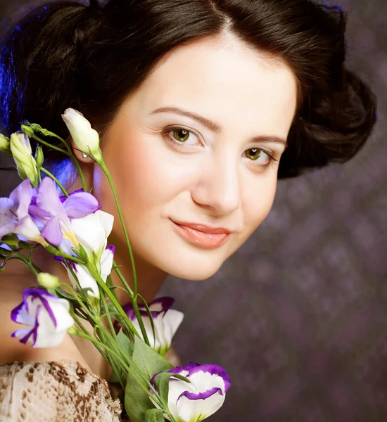 Beautiful woman with lilac flower — Stock Photo, Image