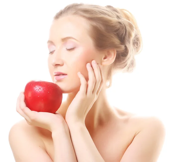 Blonde vrouw met een appel — Stockfoto